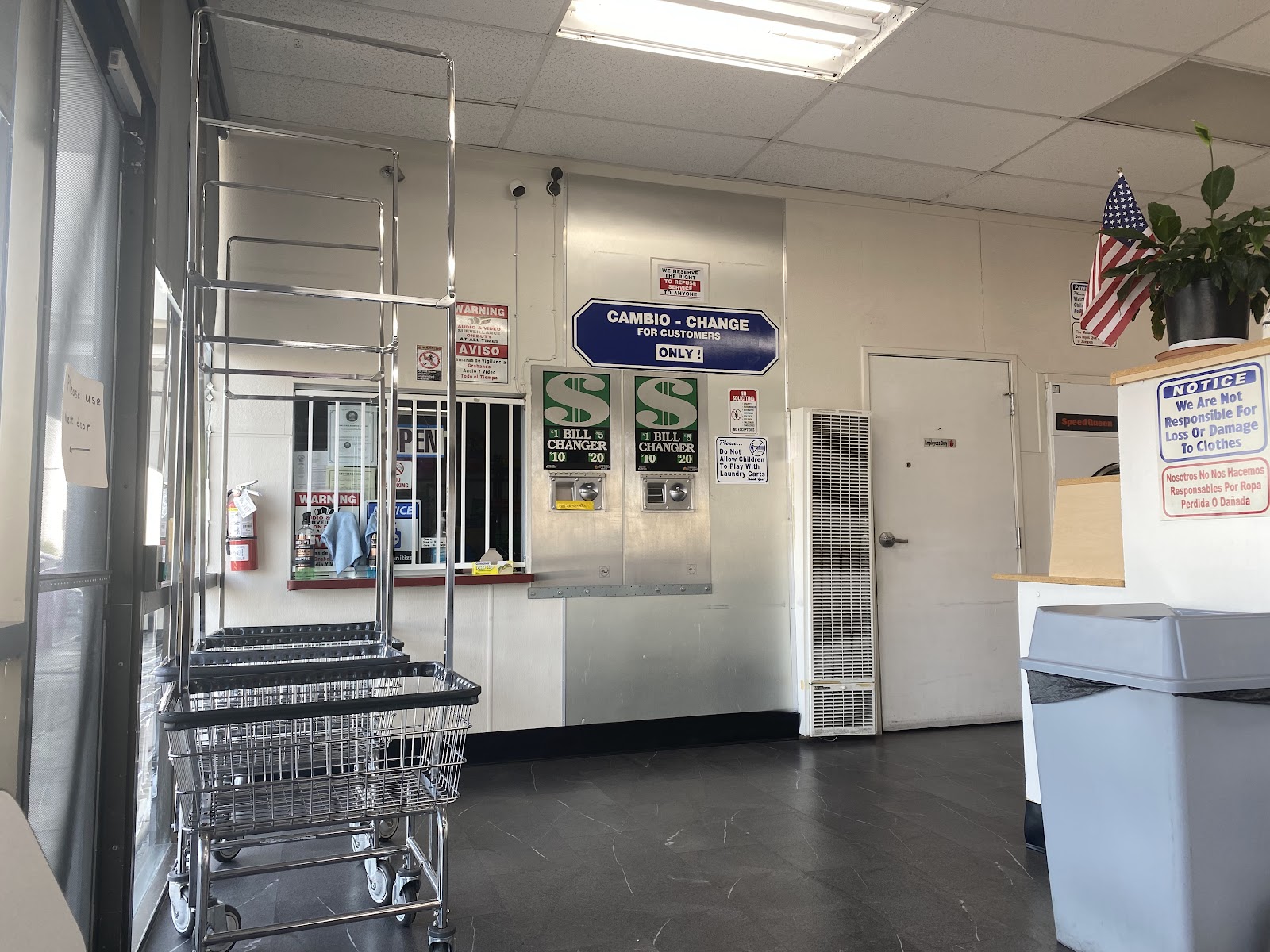 Front counter area with bill changers, laundry carts and service window